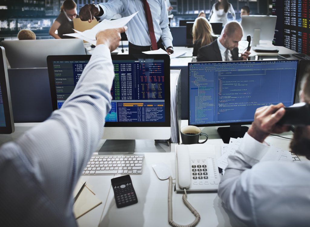 People working in a busy security office