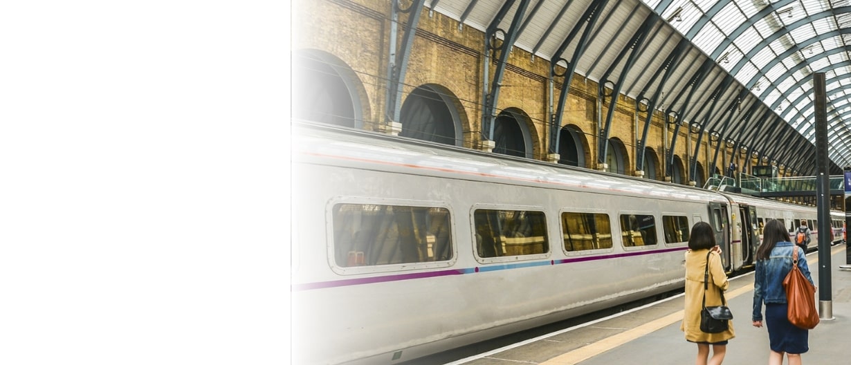 Photo showing two women walking along a platform at London King's Cross