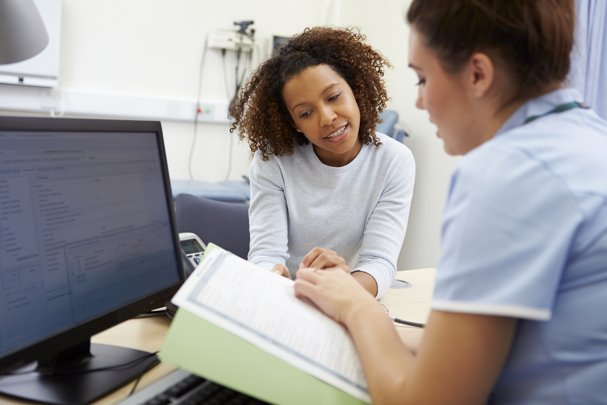 Nurse discussing test results with patient