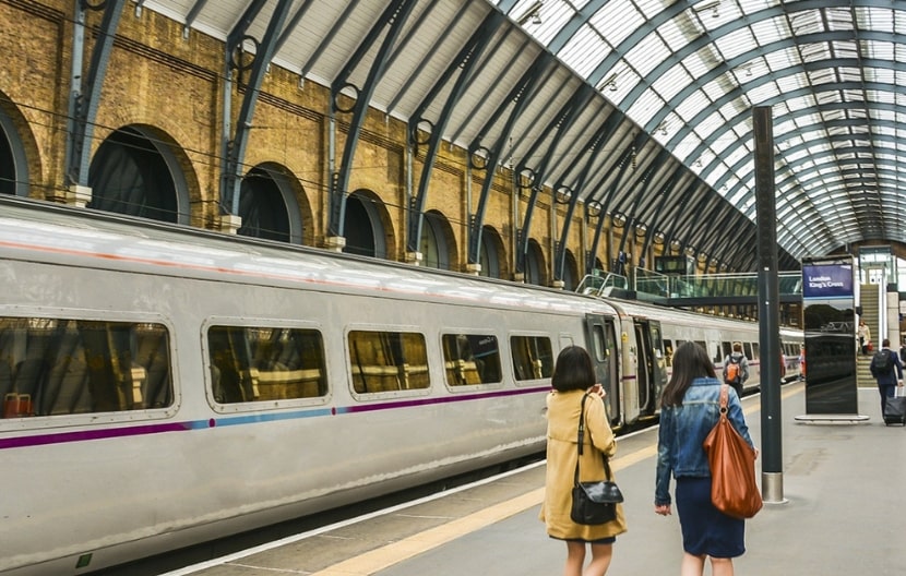 Two women walking along a platform at London King's Cross